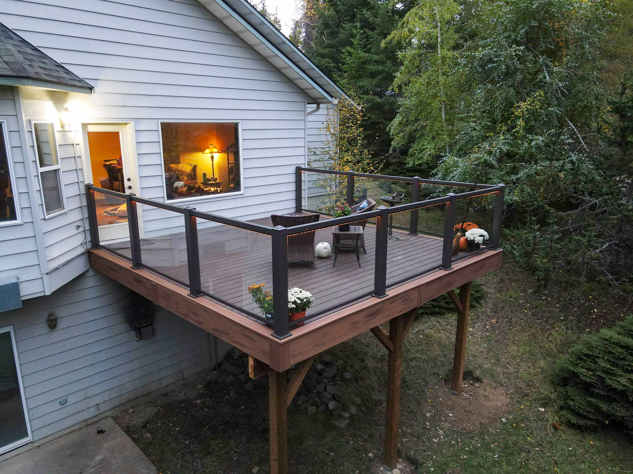 Beautiful deck railing and lighting in the forest