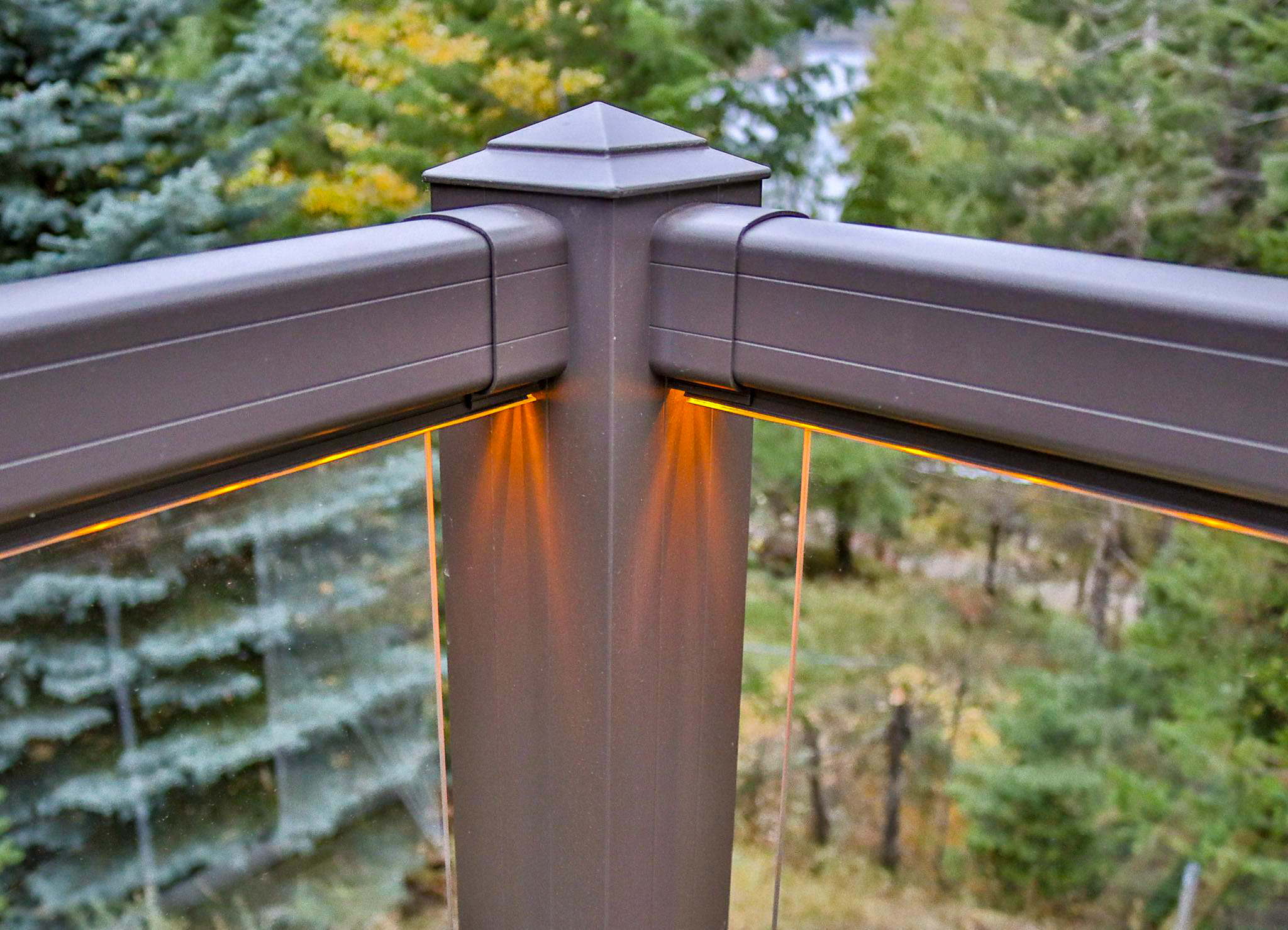 Fancy gold deck lighting with metal railing and glass