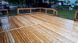 lite stained cedar deck with railing